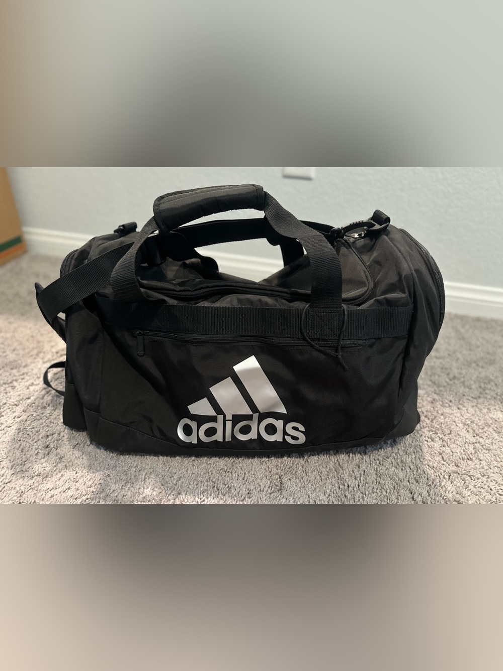 black adidas Defender duffel bag with White Logo